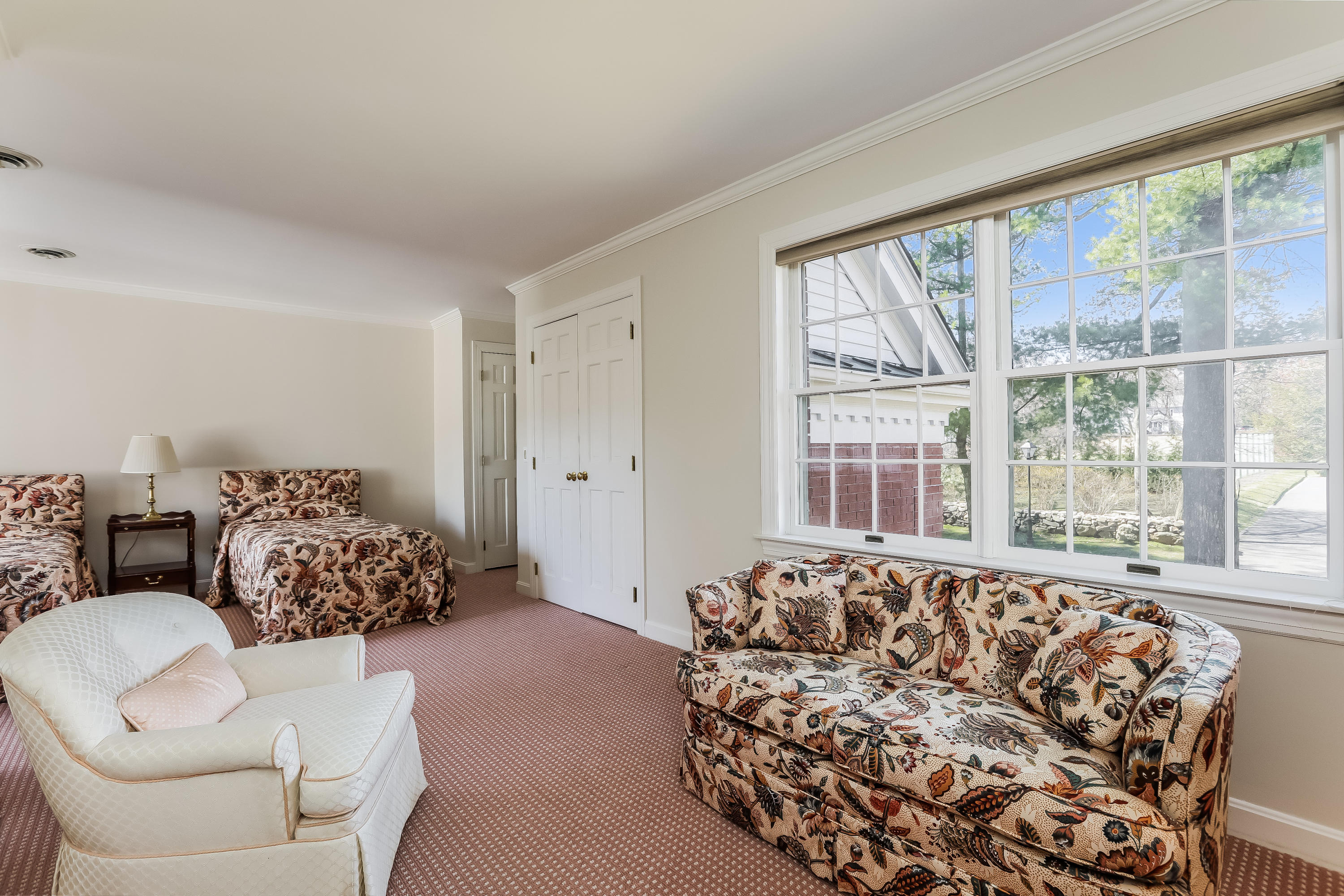 1 Shields Lane Darien, CT 06820 - Photo 24 of 41 a living room with furniture and a large window