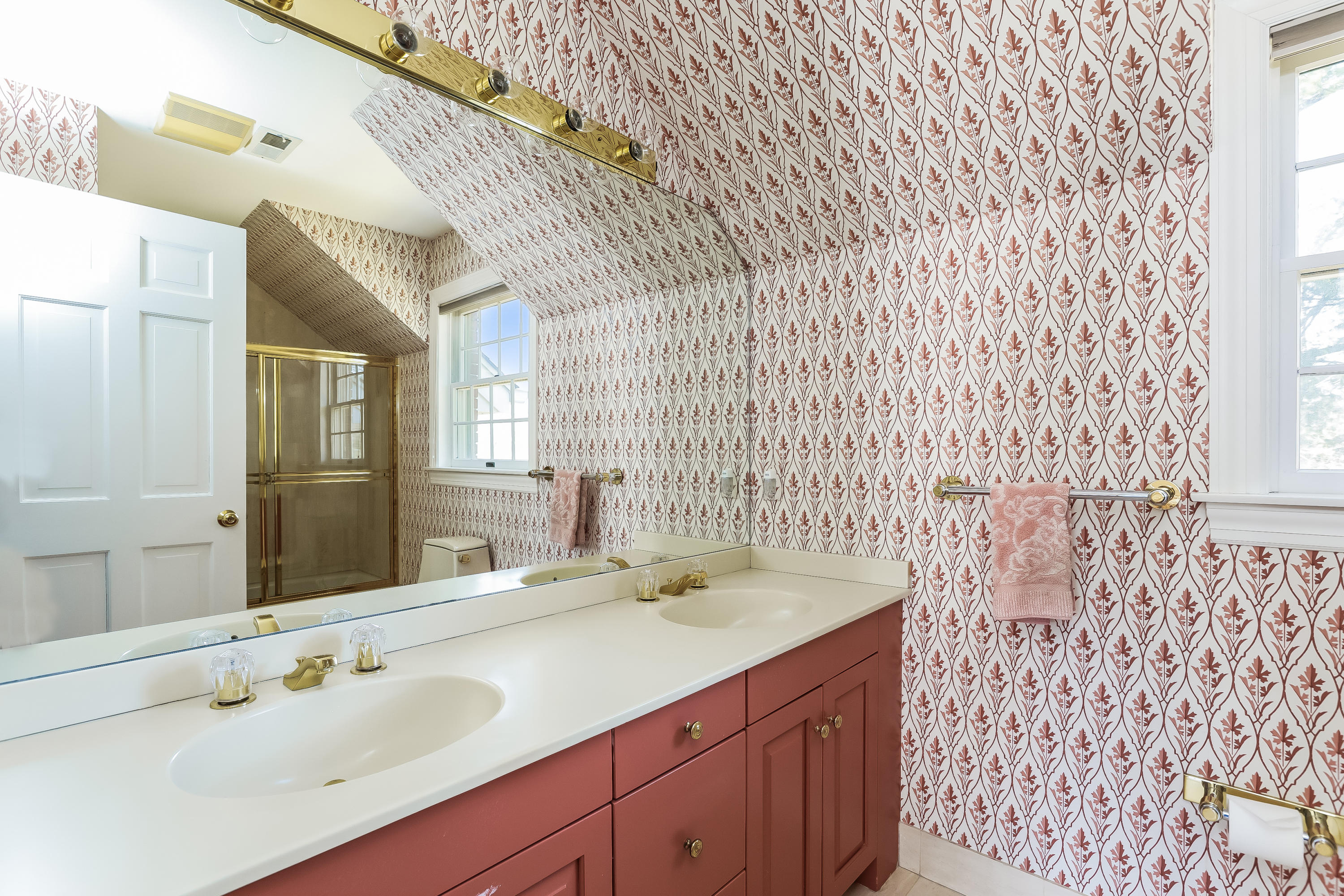 1 Shields Lane Darien, CT 06820 - Photo 25 of 41 a bathroom with a sink a mirror and a shower curtain