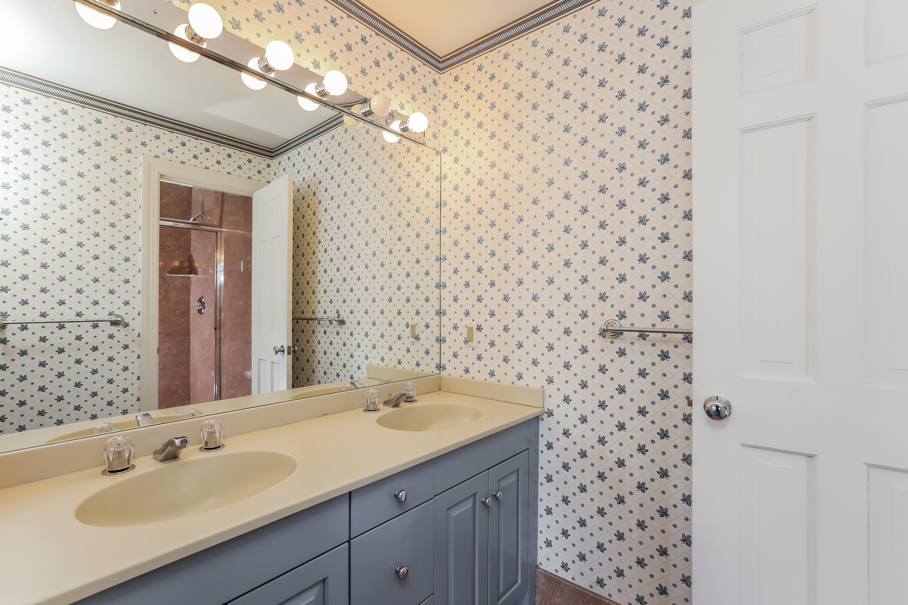 1 Shields Lane Darien, CT 06820 - Photo 27 of 41 a bathroom with a sink a vanity and a mirror