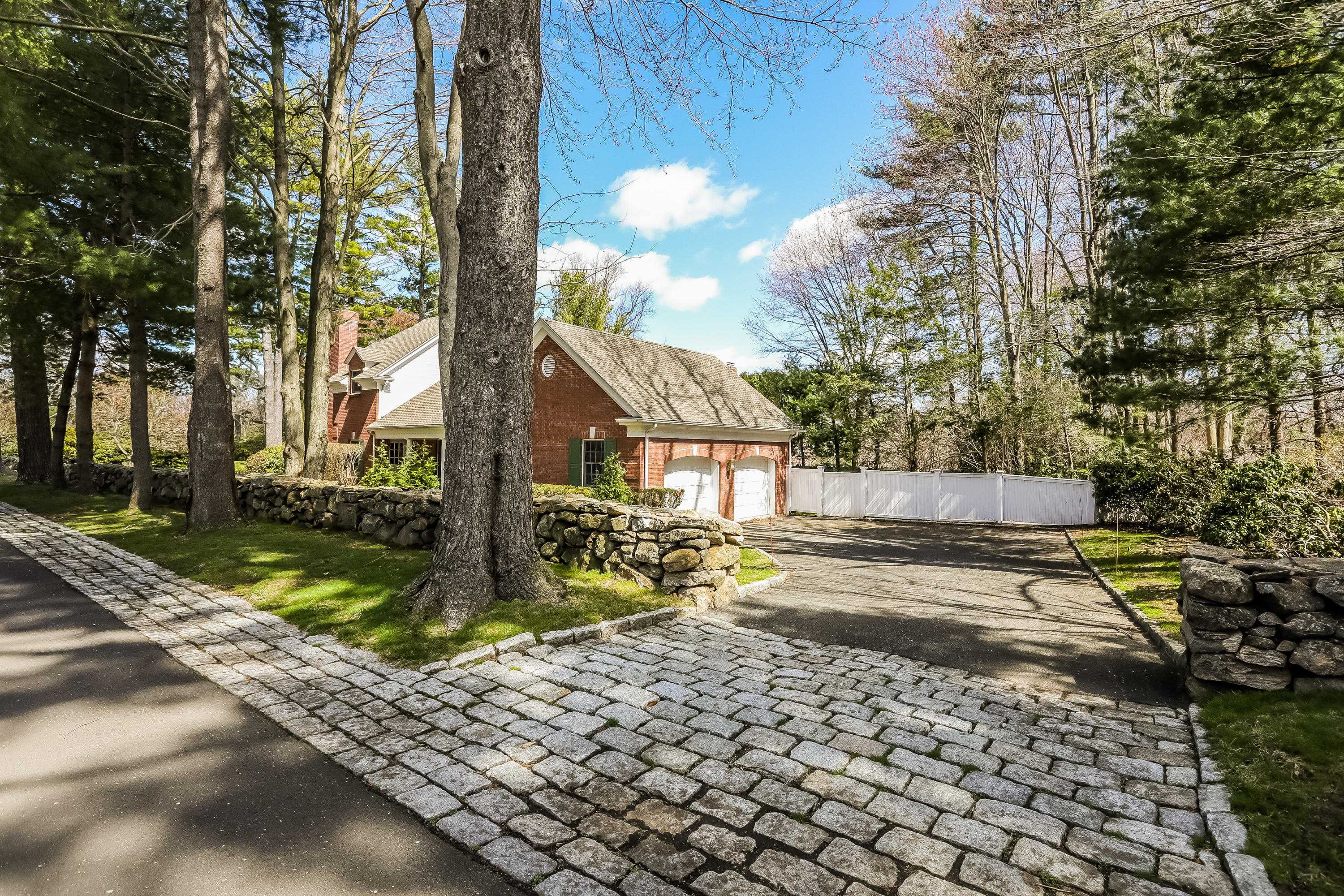 1 Shields Lane Darien, CT 06820 - Photo 34 of 41 a front view of a house with garden