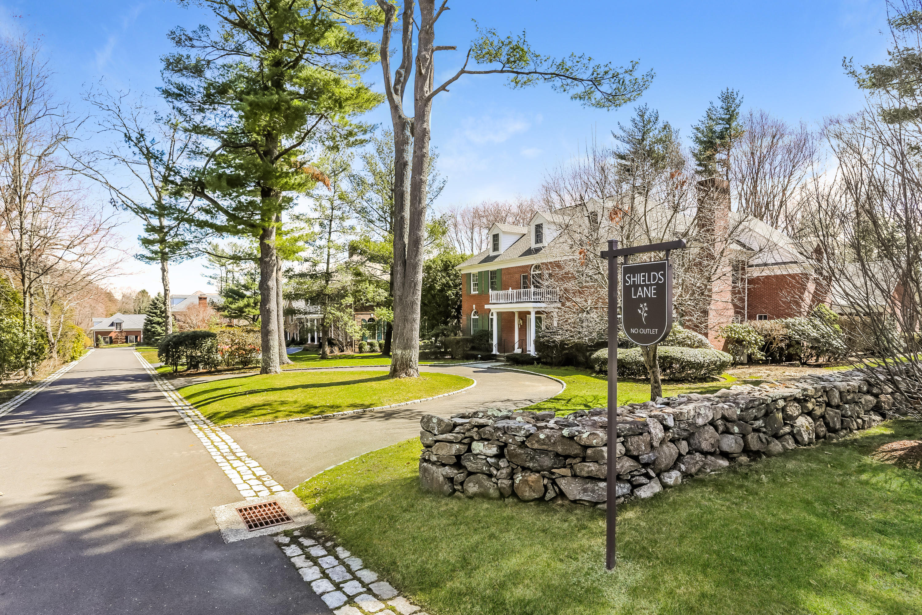 1 Shields Lane Darien, CT 06820 - Photo 38 of 41 a view of a house with a big yard and potted plants