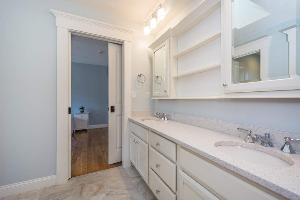 21 Sage Hill Road Wayland, MA 01778 - Photo 32 of 42 a en suite bathroom with a granite countertop sink and mirror