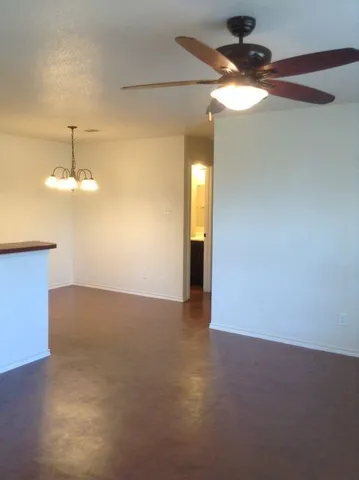 a kitchen with stainless steel appliances a stove a microwave and a refrigerator