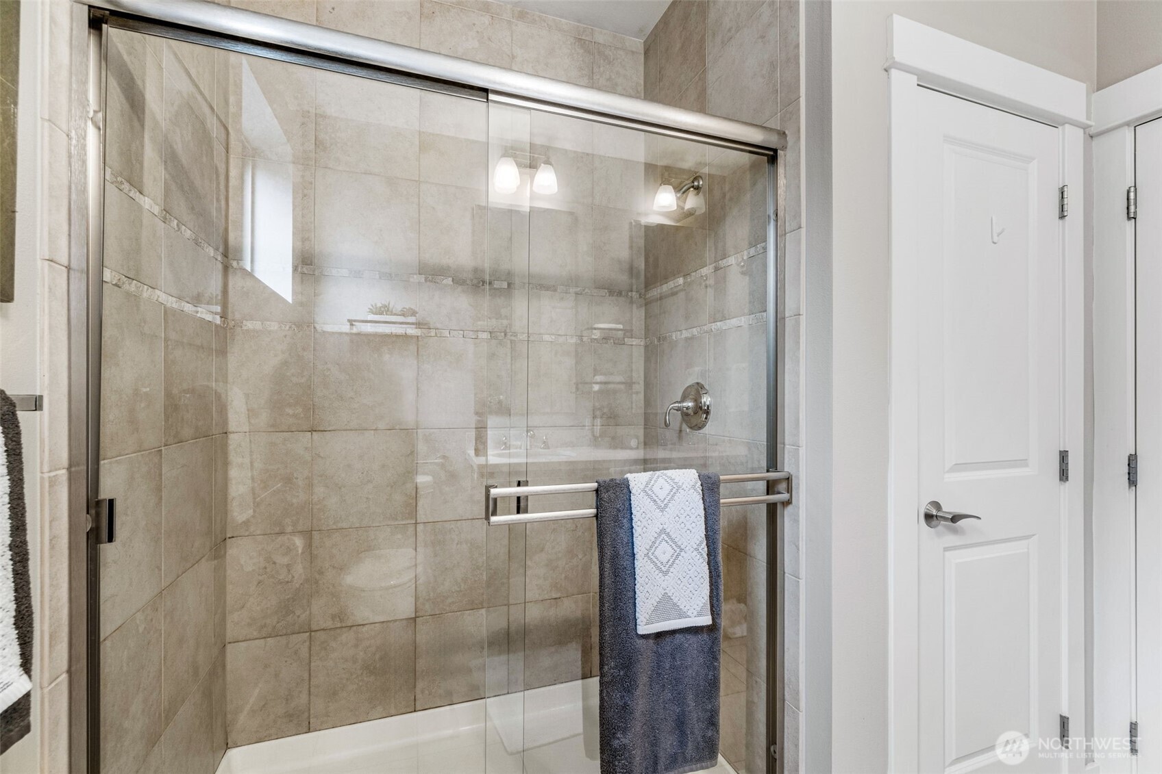 15700 116th Avenue Northeast, Unit 102A Bothell, WA 98011 - Photo 18 of 35 a bathroom with a glass shower door