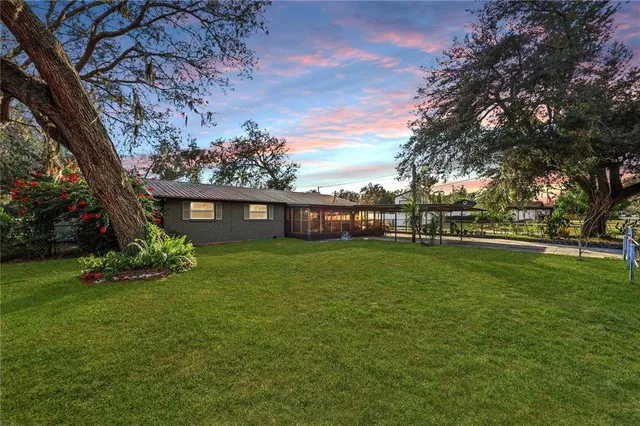 a view of a house with a big yard