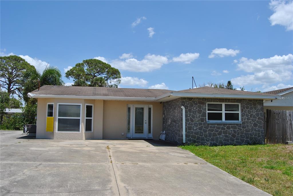 119 18th Street Northwest Ruskin, FL 33570 - Photo 1 of 20 a view of a house with a backyard