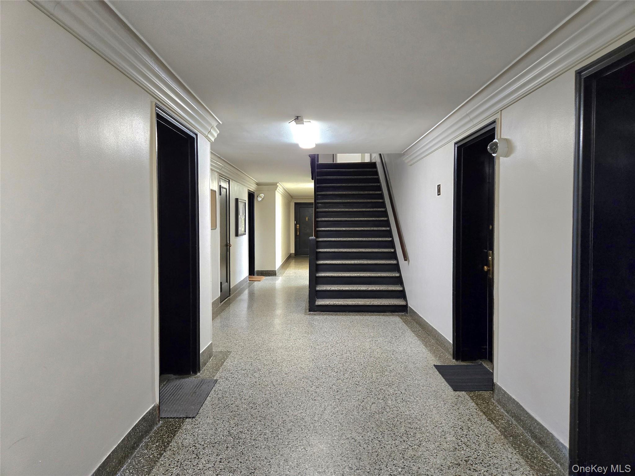 138-18 28th Road, Unit 2F Queens, NY 11354 - Photo 3 of 13 a view of a hallway with entryway and stairs