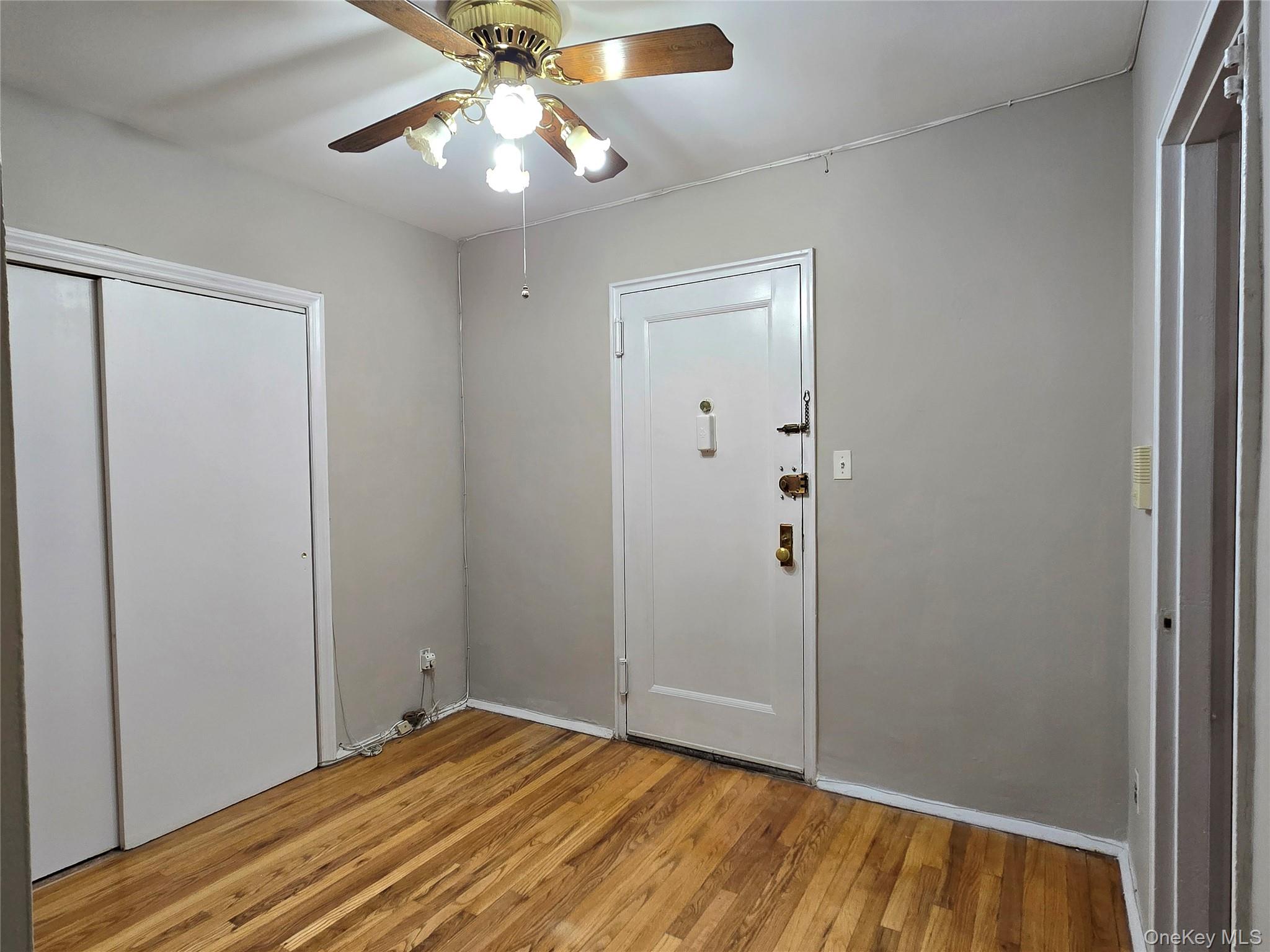 138-18 28th Road, Unit 2F Queens, NY 11354 - Photo 4 of 13 a view of an empty room with wooden floor