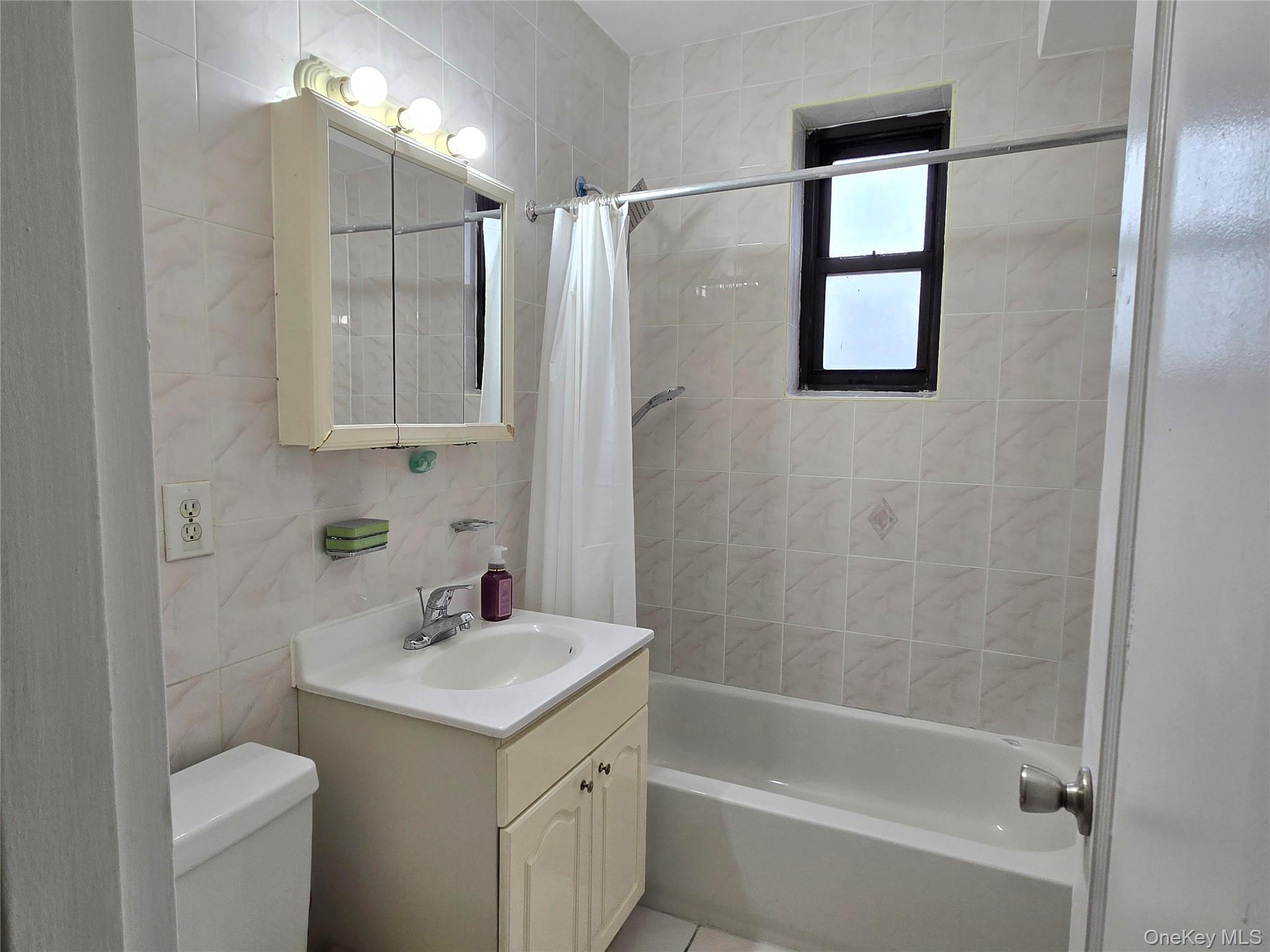 138-18 28th Road, Unit 2F Queens, NY 11354 - Photo 10 of 13 a bathroom with a sink toilet and shower