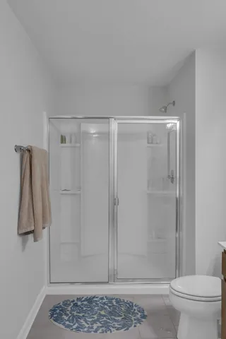 a view of walk in closet with clothes