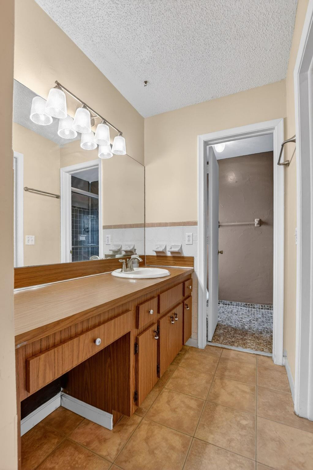 501 Northwest 54th Street Boca Raton, FL 33487 - Photo 23 of 44 a spacious bathroom with a granite countertop sink and a mirror