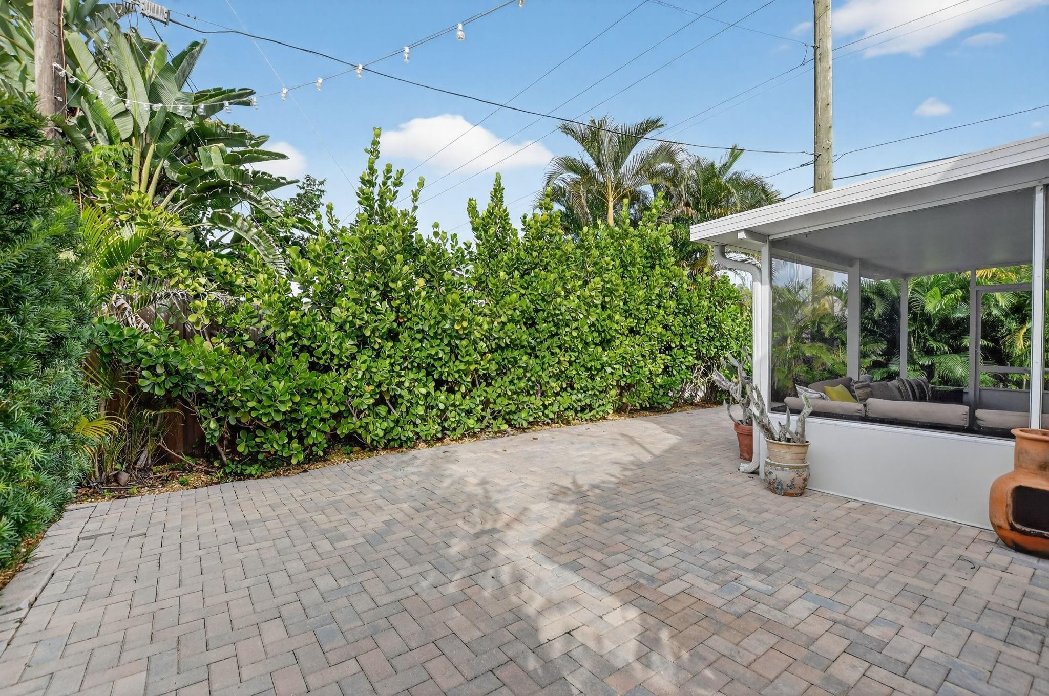 501 Northwest 54th Street Boca Raton, FL 33487 - Photo 35 of 44 a backyard of a house with lots of green space