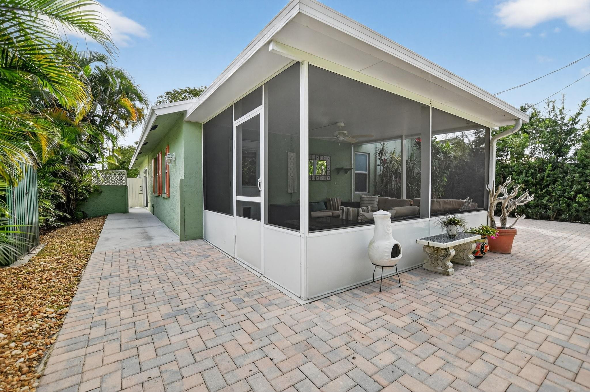 501 Northwest 54th Street Boca Raton, FL 33487 - Photo 36 of 44 a view of a house with backyard and sitting area