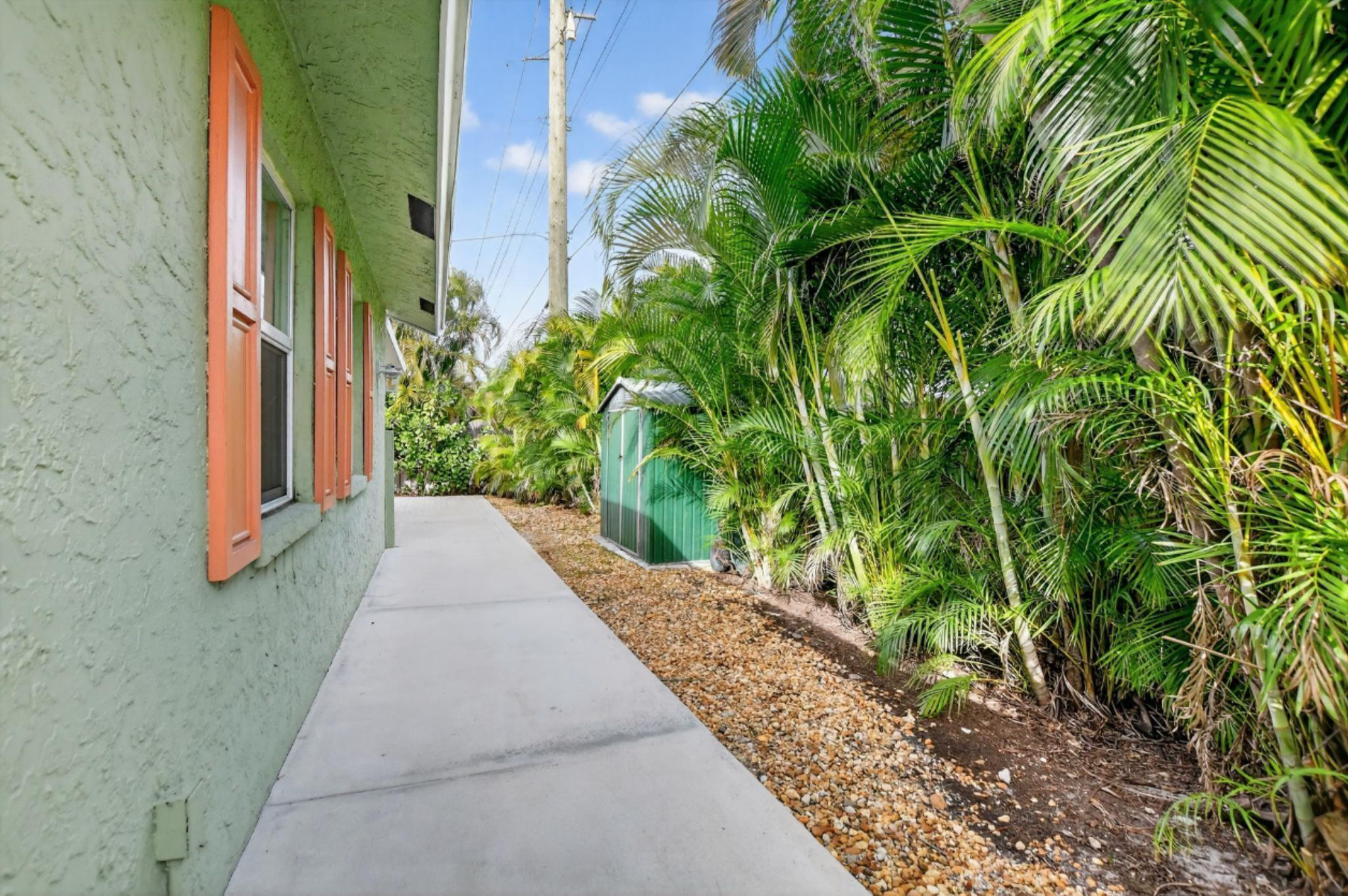 501 Northwest 54th Street Boca Raton, FL 33487 - Photo 39 of 44 a view of a pathway with plants