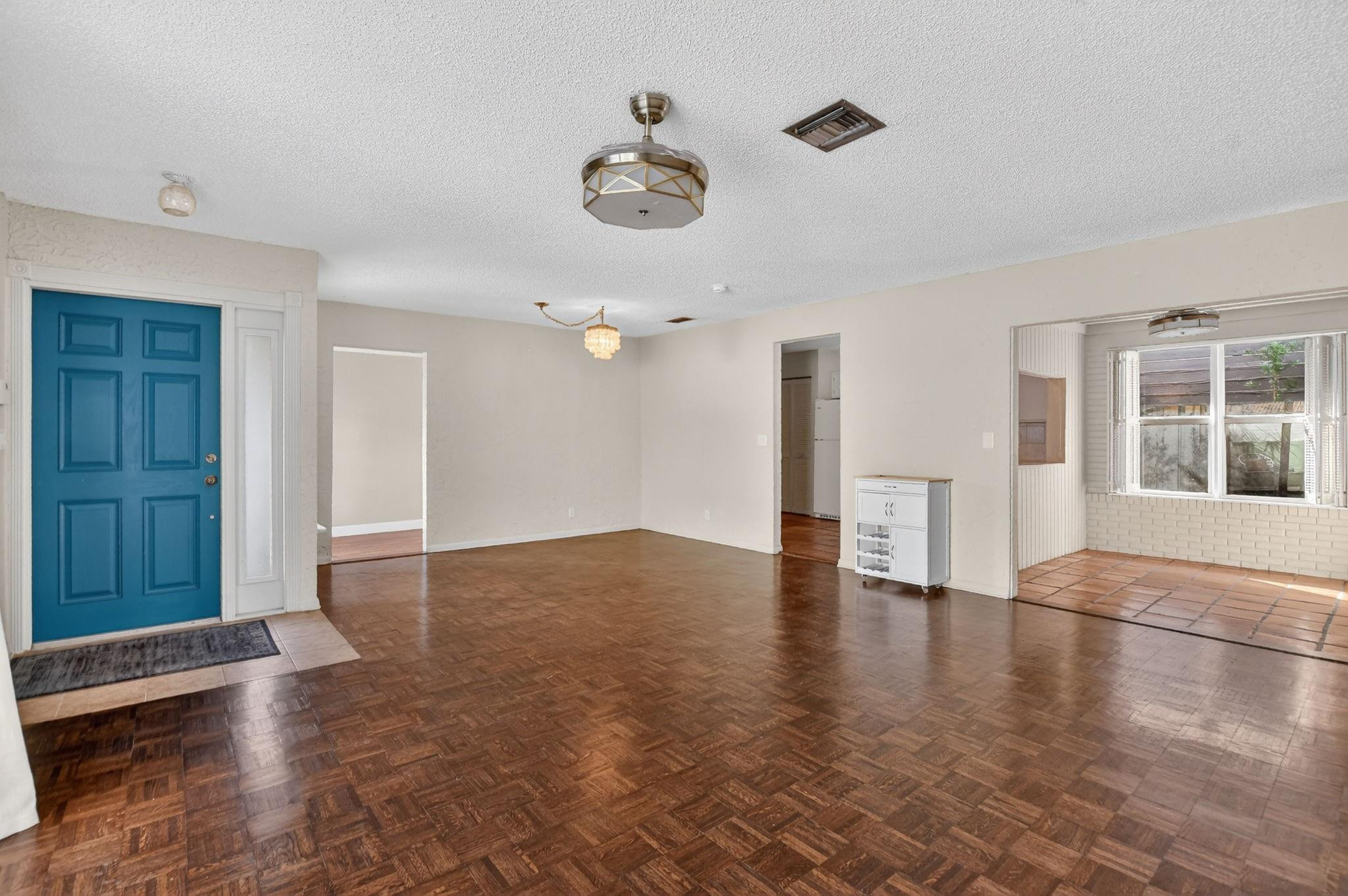 501 Northwest 54th Street Boca Raton, FL 33487 - Photo 6 of 44 wooden floor in an empty room with a window