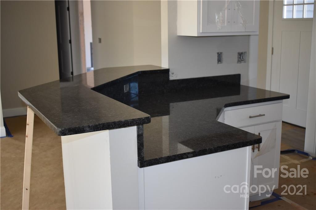 2127 State Rd S-46-1474, Unit 4 Clover, SC 29710 - Photo 3 of 23 a kitchen with granite countertop a stove and a refrigerator