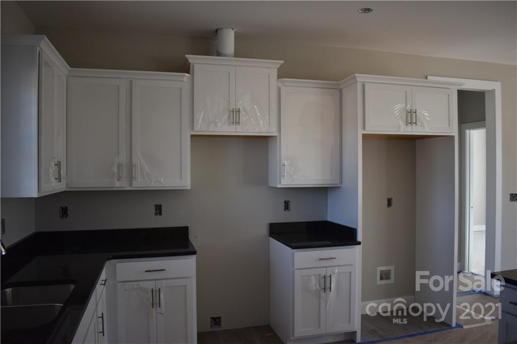 2127 State Rd S-46-1474, Unit 4 Clover, SC 29710 - Photo 5 of 23 a kitchen with stainless steel appliances a stove a sink and cabinets
