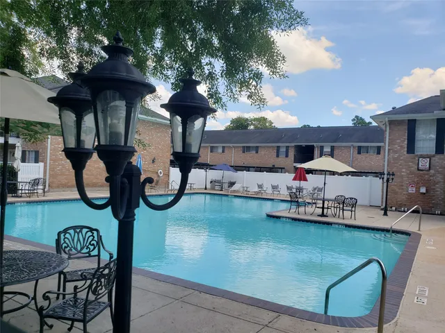 a front view of house with yard barbeque oven and outdoor seating