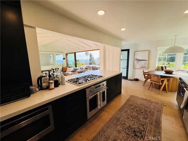 a kitchen with a stove and cabinets