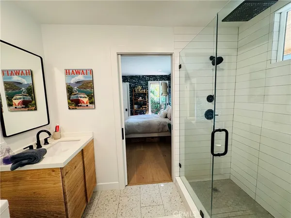 a bedroom with a bed window and a potted plant