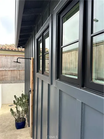 a view of a table and chairs in backyard