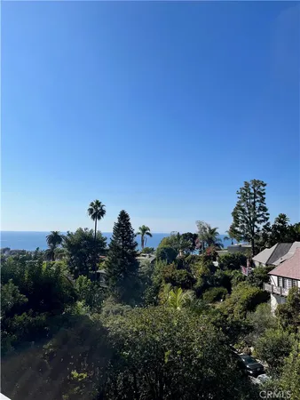 a view of a city and trees
