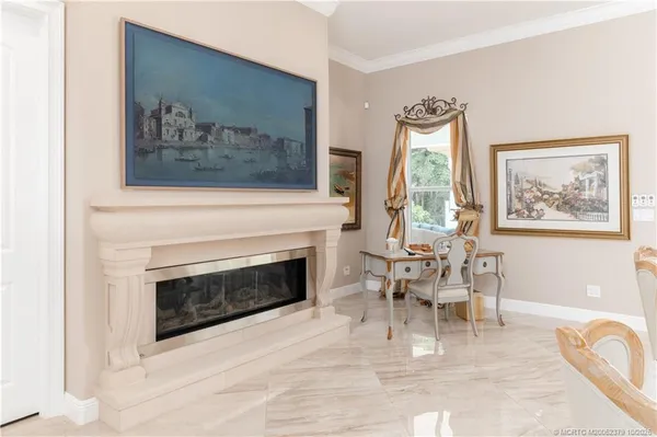 a bathroom with double vanity sinks a toilet a mirror and a tub