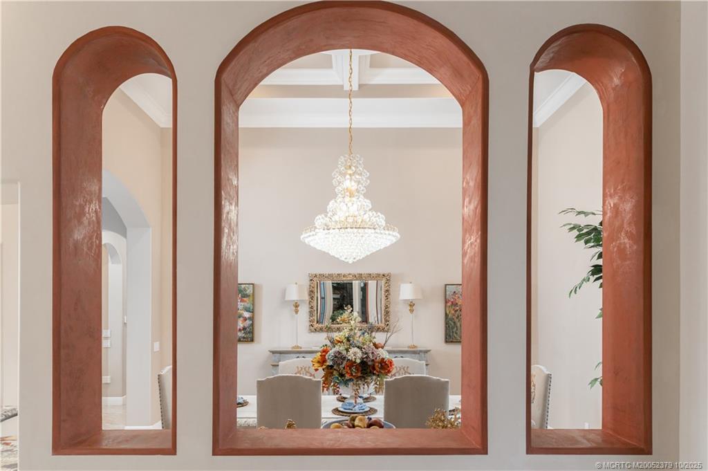 2690 Northwest Collins Cove Road Stuart, FL 34994 - Photo 23 of 100 a front view of a house with large windows