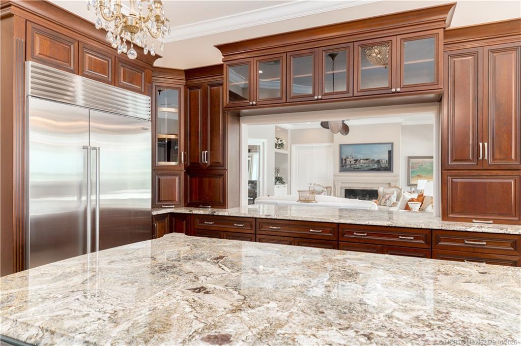 2690 Northwest Collins Cove Road Stuart, FL 34994 - Photo 32 of 100 a view of kitchen with refrigerator and cabinets