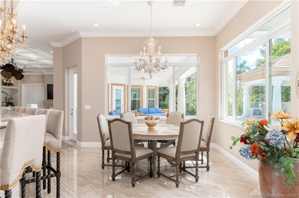 2690 Northwest Collins Cove Road Stuart, FL 34994 - Photo 34 of 100 a view of a dining room with furniture window and outside view
