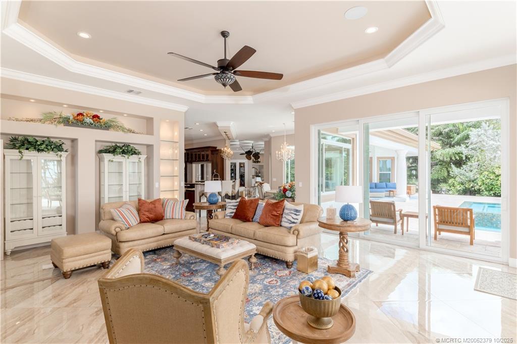 2690 Northwest Collins Cove Road Stuart, FL 34994 - Photo 37 of 100 a living room with furniture and a large window
