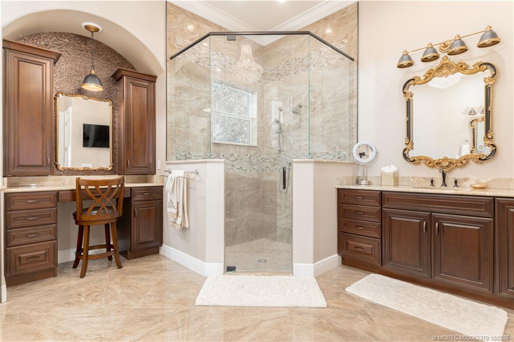 2690 Northwest Collins Cove Road Stuart, FL 34994 - Photo 46 of 100 a bath room with a sink vanity and a mirror