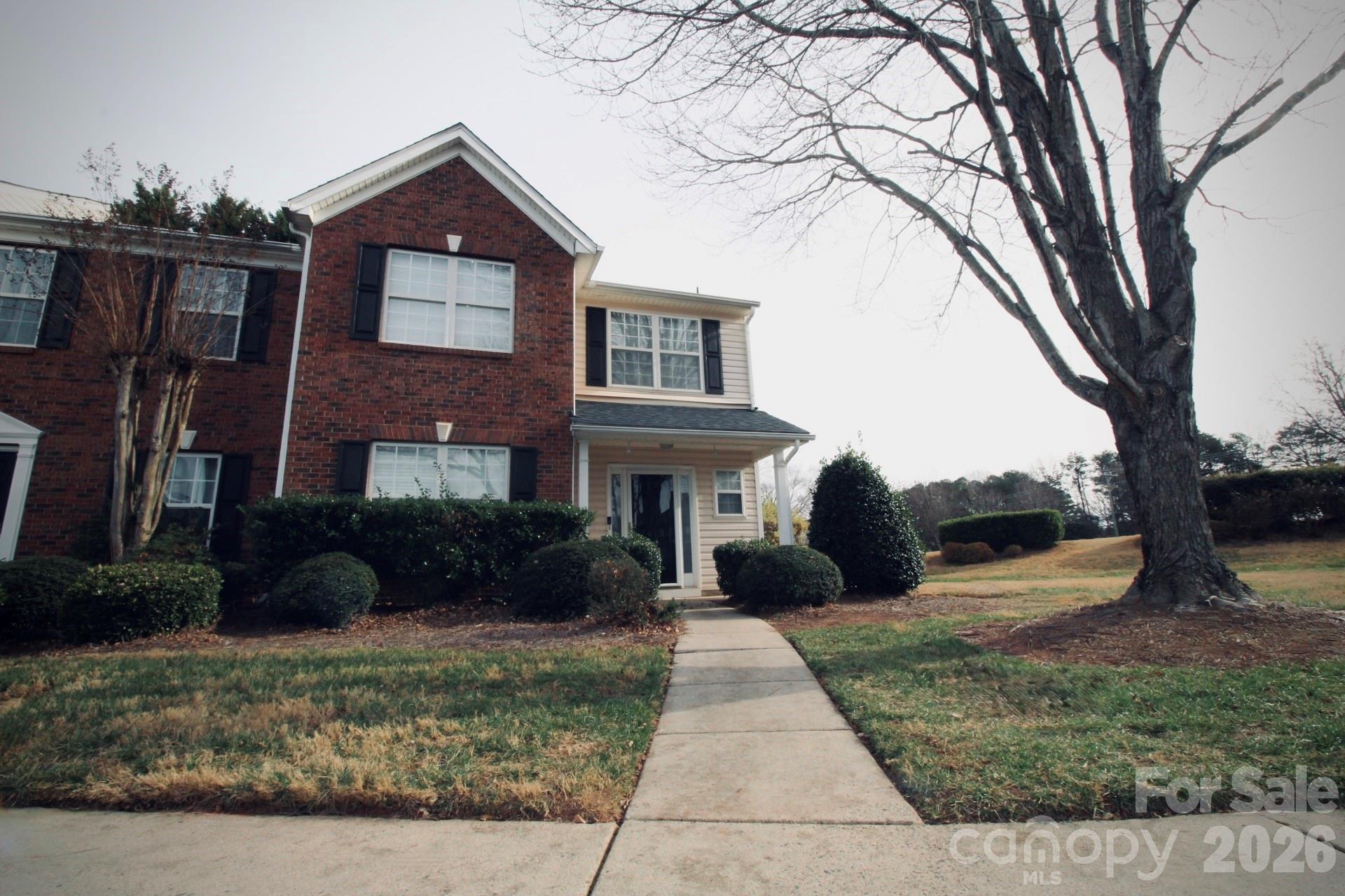 7479 Bluff Point Lane, Unit 13 Denver, NC 28037 - Photo 1 of 26 a front view of a house with a yard