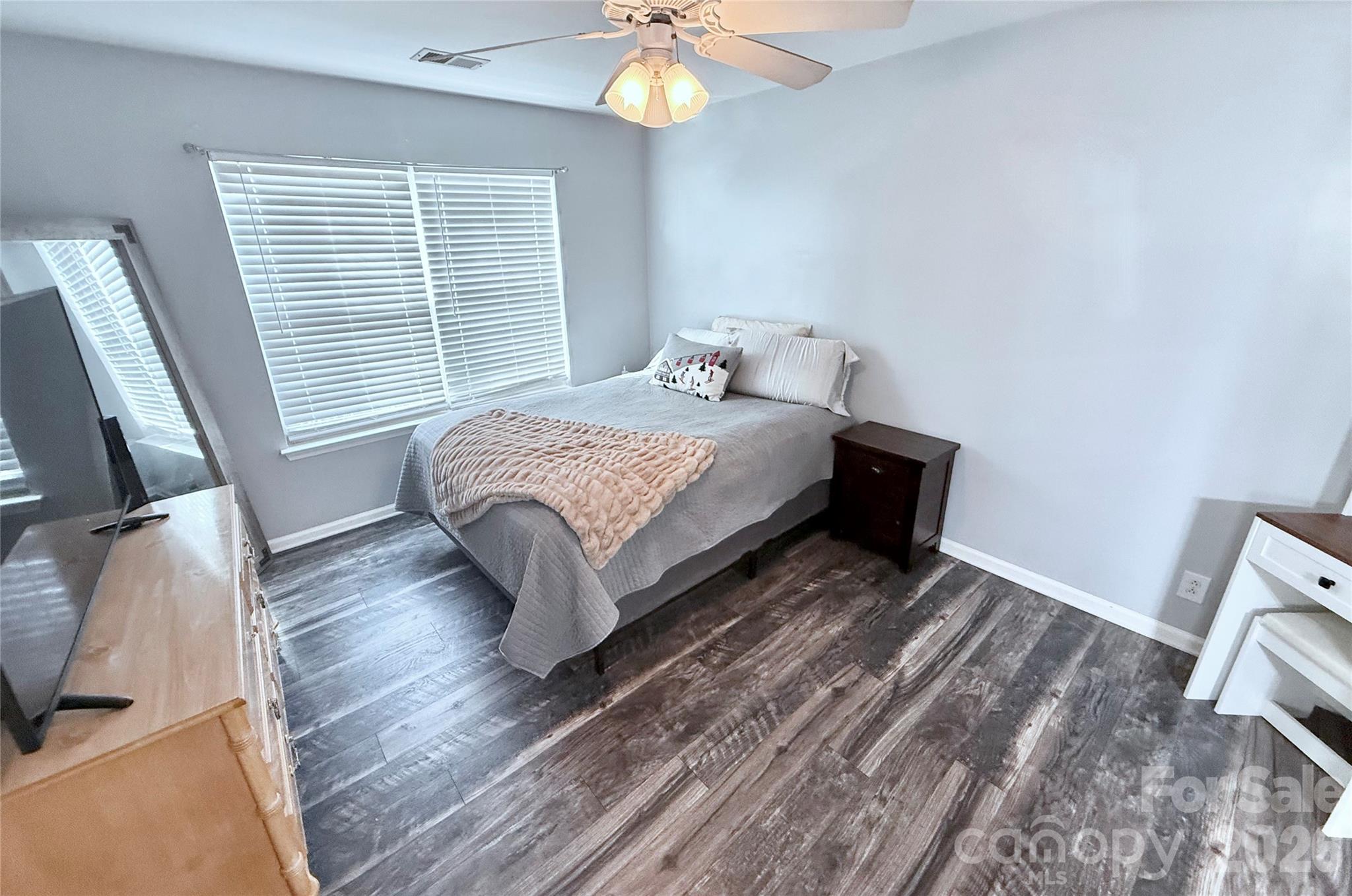 7479 Bluff Point Lane, Unit 13 Denver, NC 28037 - Photo 17 of 26 a bedroom with a bed and a window
