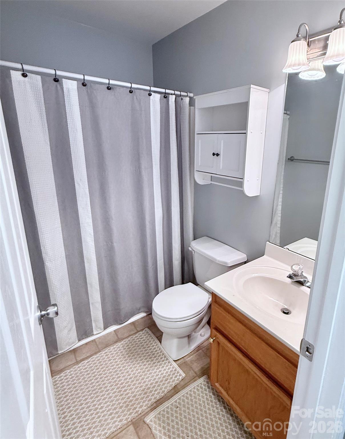 7479 Bluff Point Lane, Unit 13 Denver, NC 28037 - Photo 20 of 26 a bathroom with a sink toilet and shower