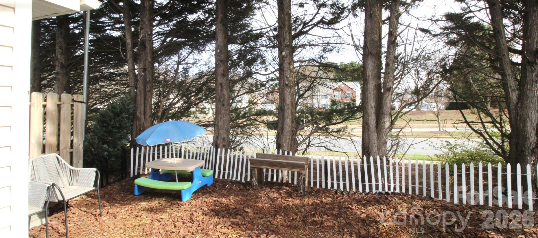 7479 Bluff Point Lane, Unit 13 Denver, NC 28037 - Photo 22 of 26 a garden view with a seating space