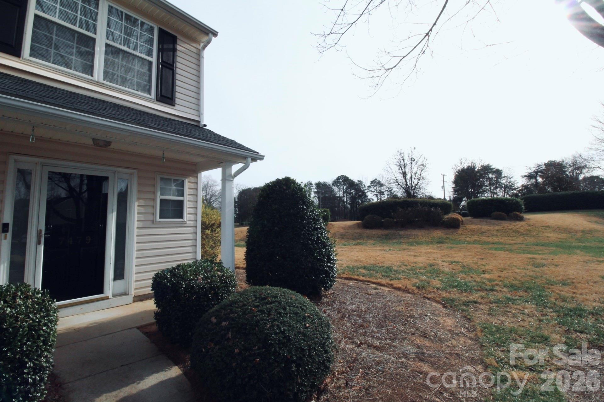 7479 Bluff Point Lane, Unit 13 Denver, NC 28037 - Photo 24 of 26 a view of a house with a yard