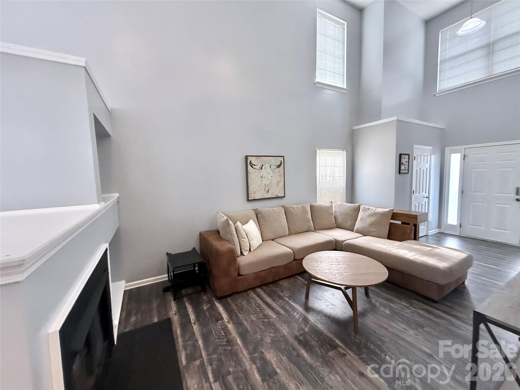 7479 Bluff Point Lane, Unit 13 Denver, NC 28037 - Photo 3 of 26 a living room with furniture and a table