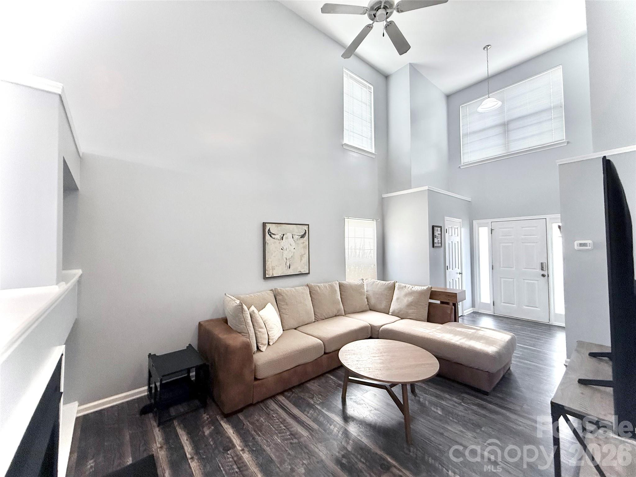 7479 Bluff Point Lane, Unit 13 Denver, NC 28037 - Photo 4 of 26 a living room with furniture and a rug