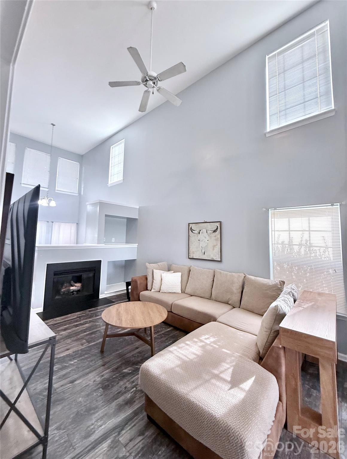 7479 Bluff Point Lane, Unit 13 Denver, NC 28037 - Photo 5 of 26 a living room with furniture fireplace and a window