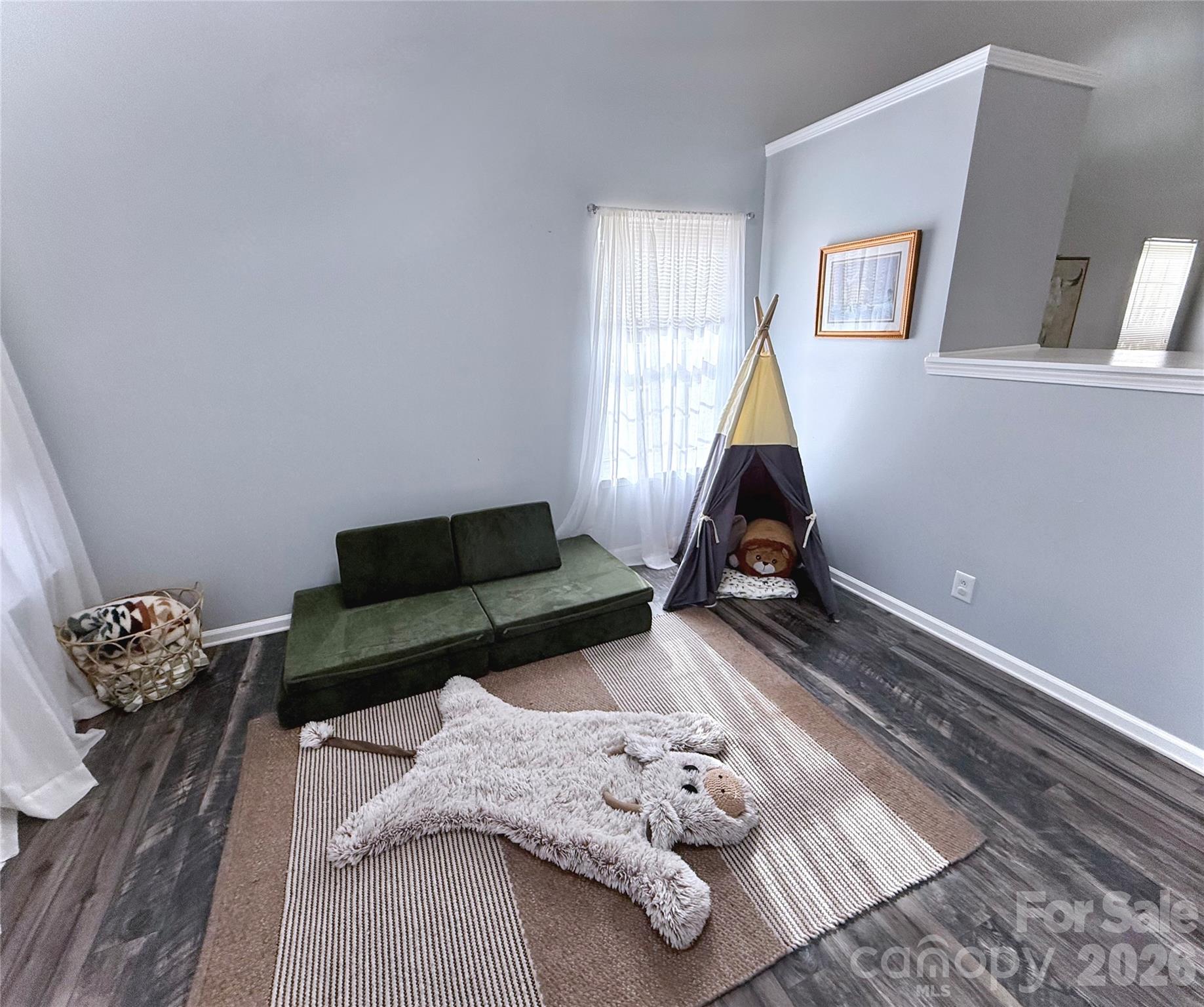 7479 Bluff Point Lane, Unit 13 Denver, NC 28037 - Photo 7 of 26 a living room with furniture chess board and a window