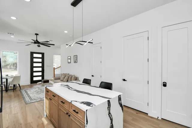 a view of a kitchen counter space and wooden floor