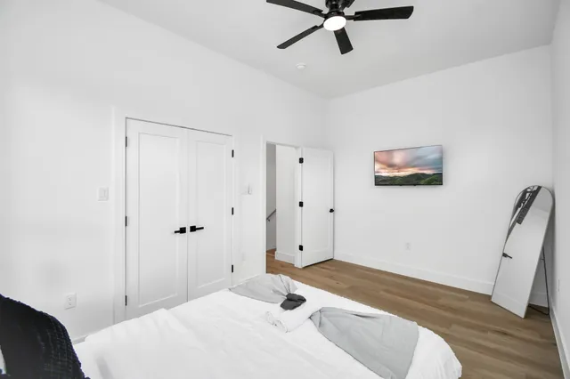 a bedroom with a bed and window