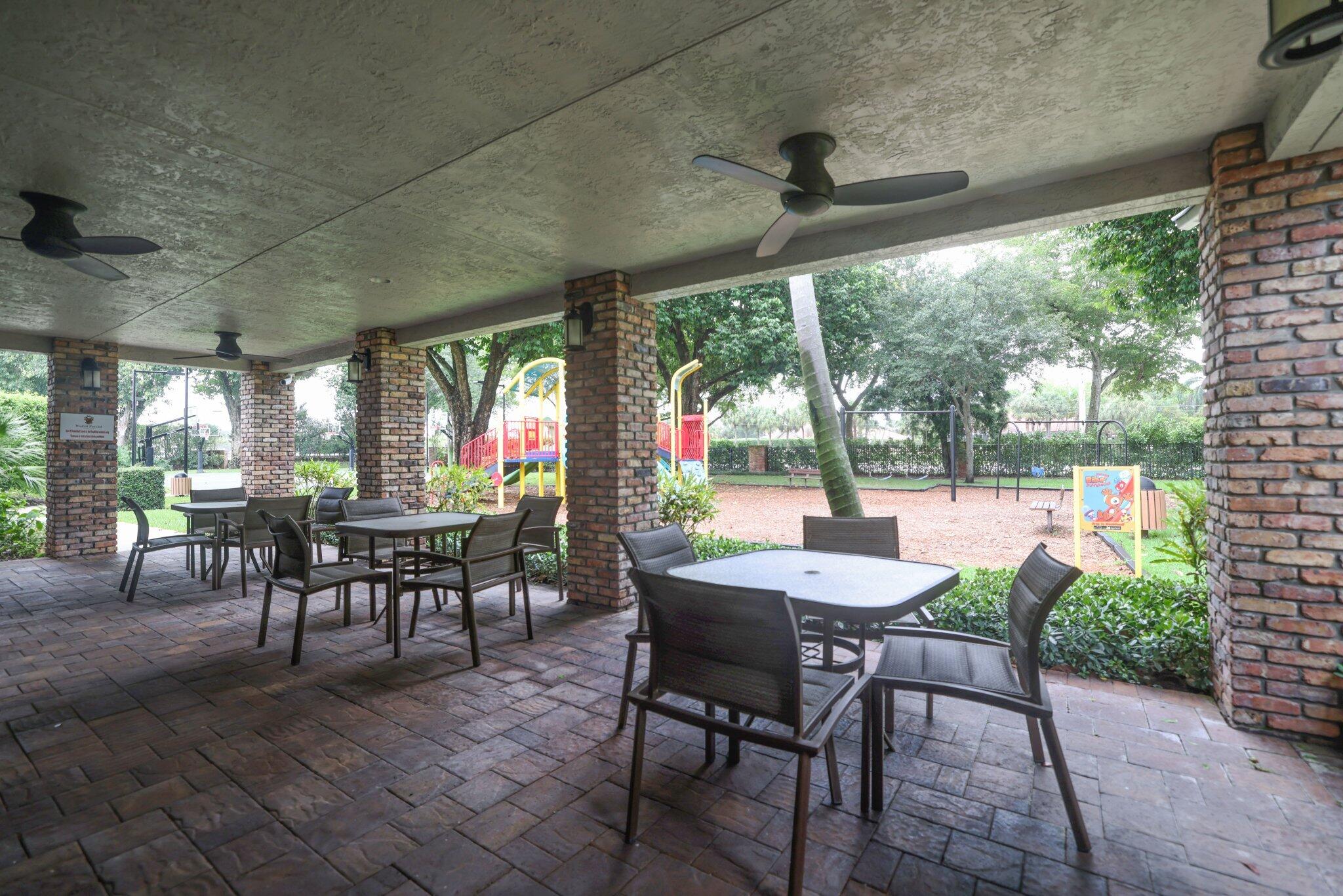3235 Hyde Circle Boca Raton, FL 33434 - Photo 73 of 76 Outdoor tables at clubhouse