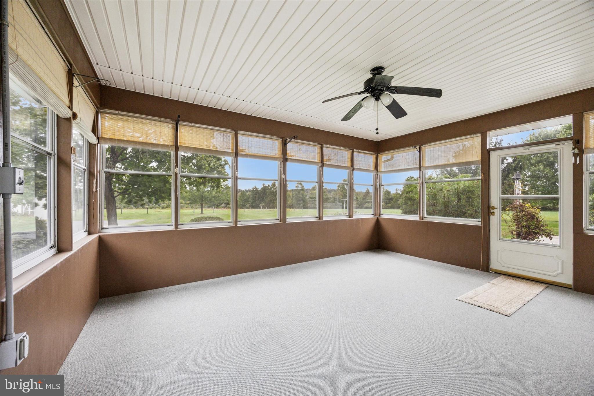 1690 Kumry Road Quakertown, PA 18951 - Photo 16 of 34 a view of an empty room with a window and a chandelier