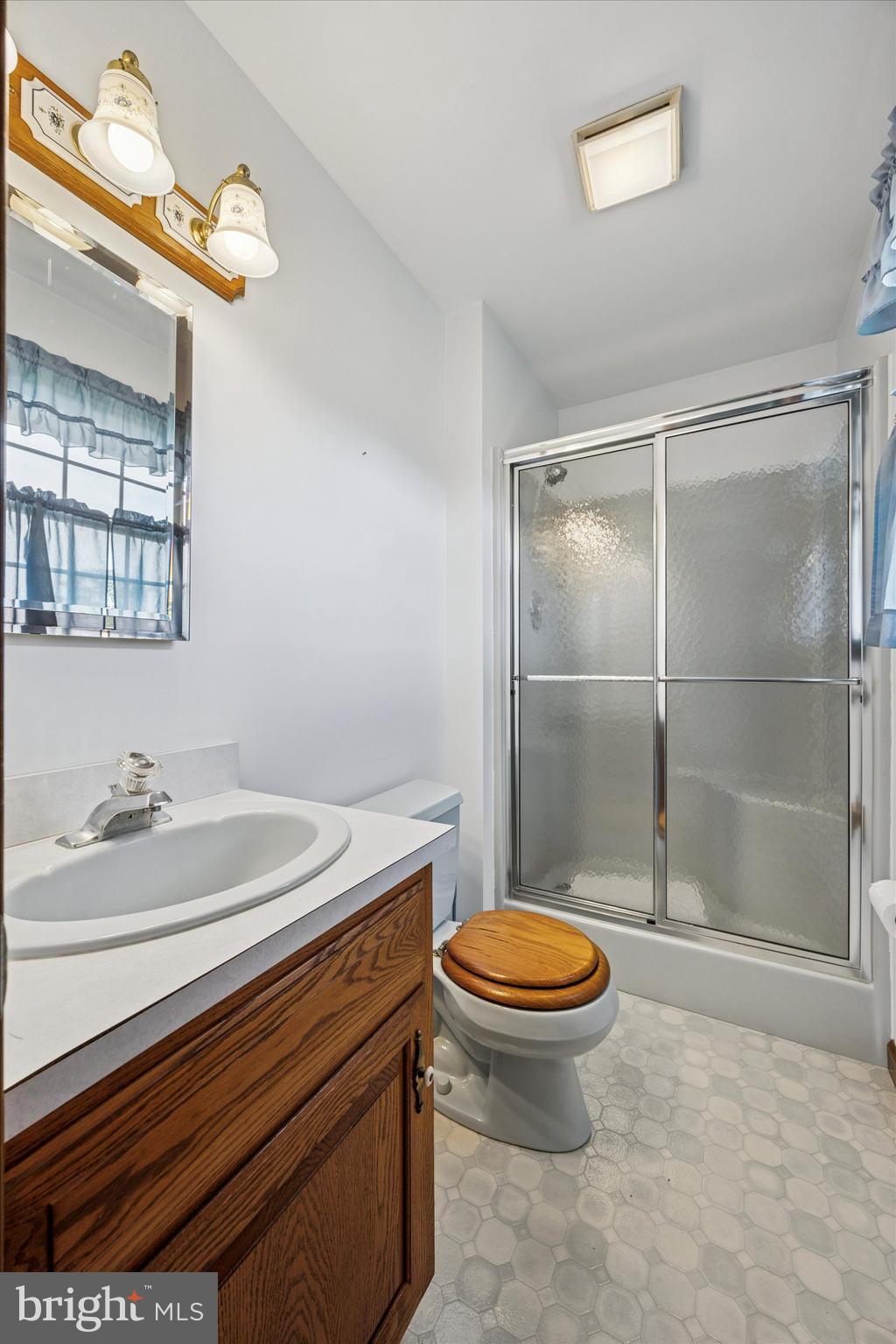 1690 Kumry Road Quakertown, PA 18951 - Photo 20 of 34 a bathroom with a sink toilet and shower