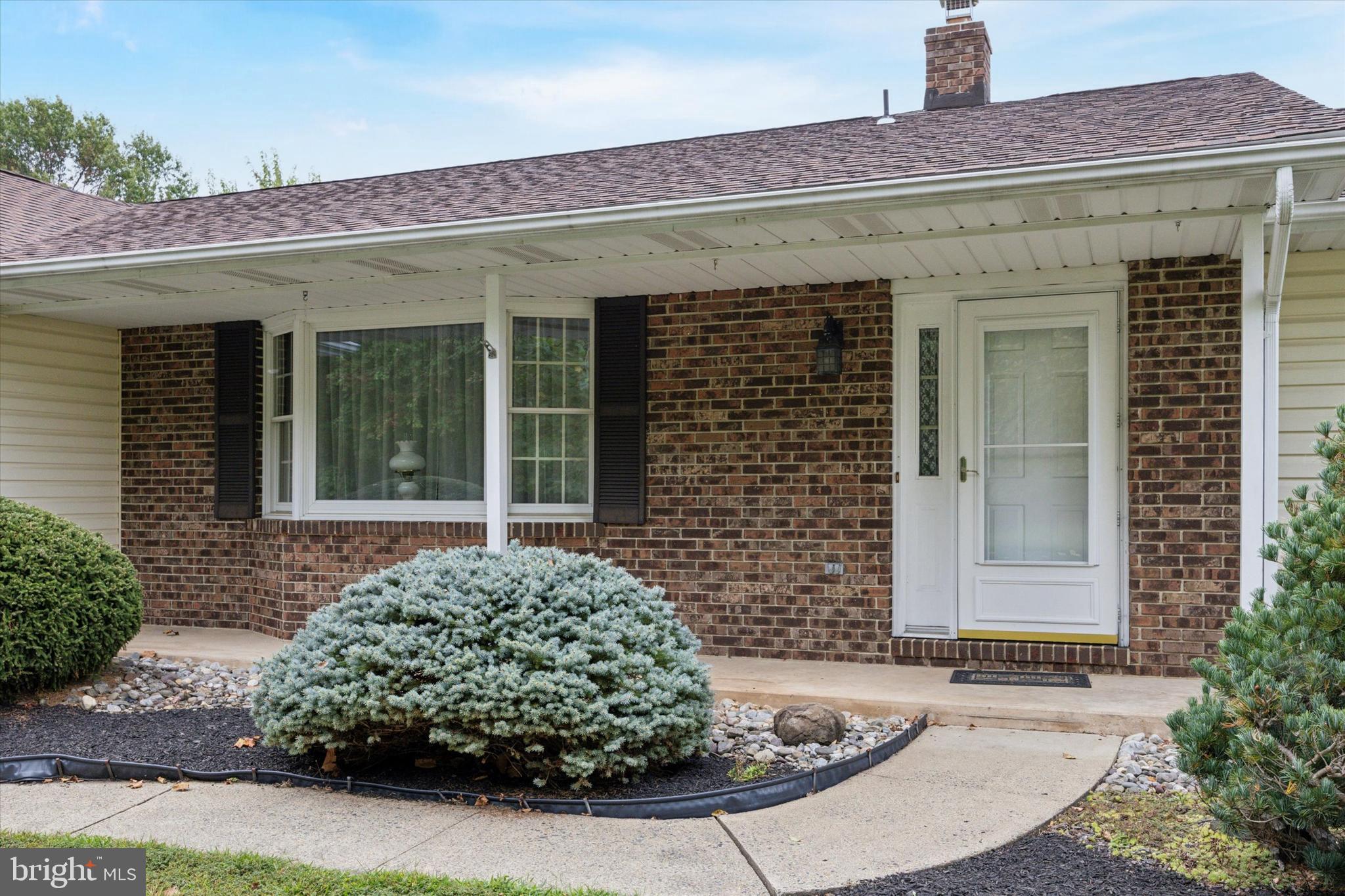 1690 Kumry Road Quakertown, PA 18951 - Photo 2 of 34 a front view of a house with garden