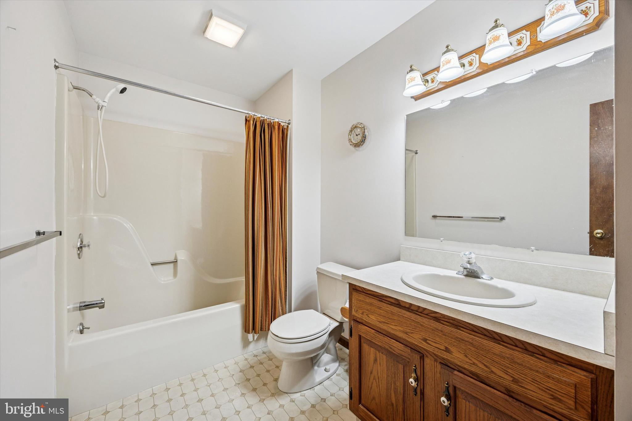 1690 Kumry Road Quakertown, PA 18951 - Photo 23 of 34 a bathroom with a sink a toilet and shower