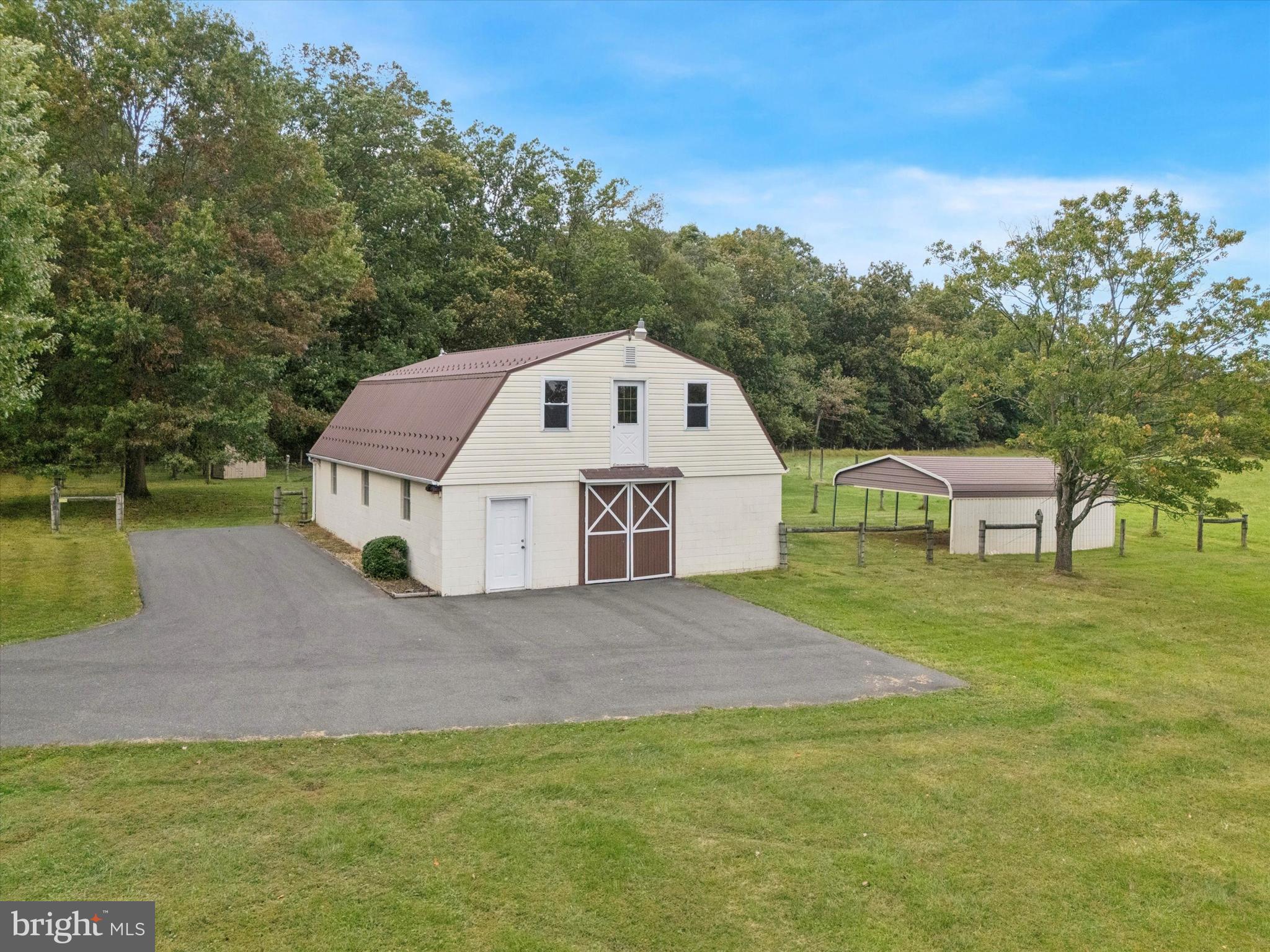 1690 Kumry Road Quakertown, PA 18951 - Photo 26 of 34 a view of a house with a yard and large trees