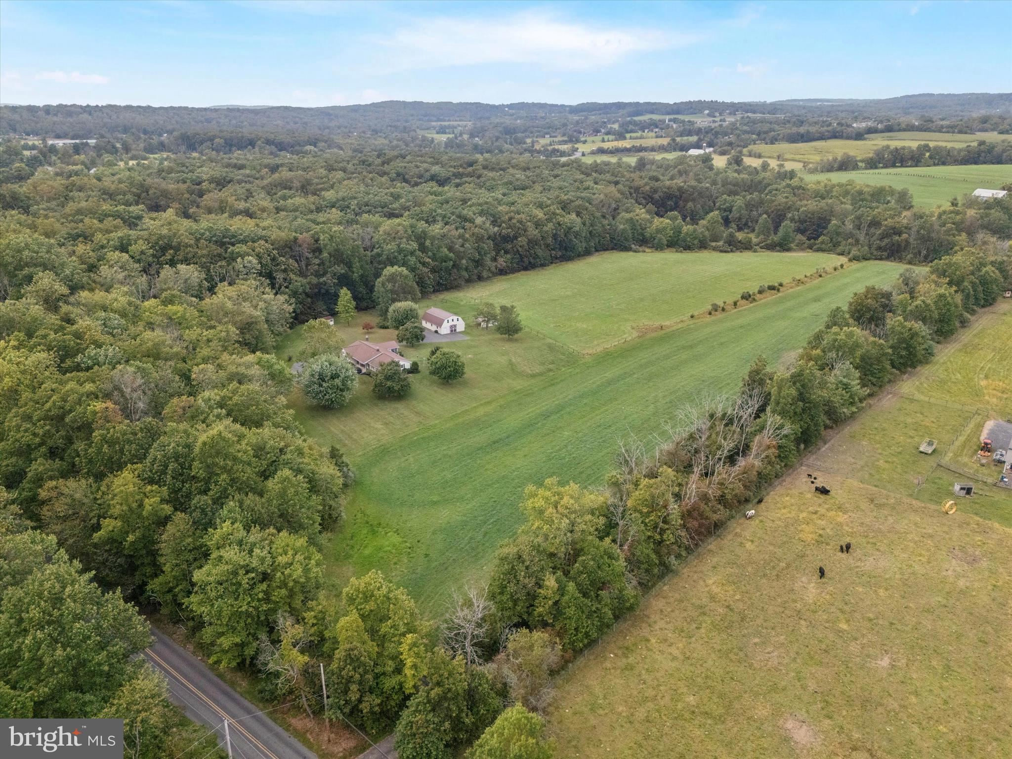 1690 Kumry Road Quakertown, PA 18951 - Photo 31 of 34 a view of a lush green hillside and houses